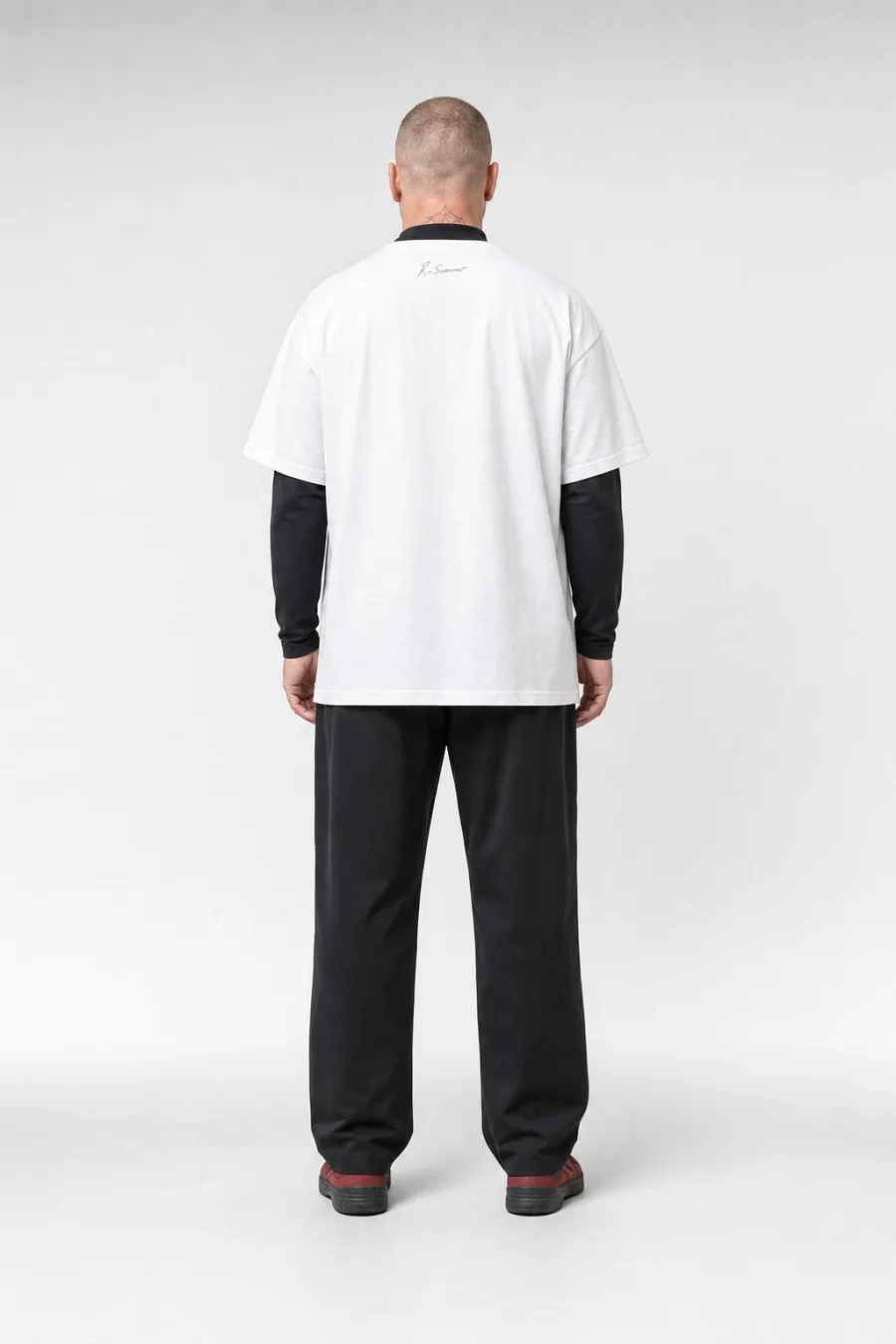 KLOTHES by objekts: full-body back view of the male model in the garment